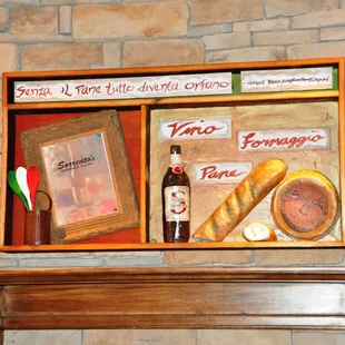 Custom art hangs above Sorrento fireplace