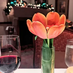 Beautiful fresh tulips in the fireplace room