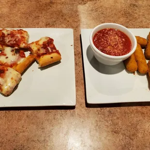 Pizza pieces and cheesesticks