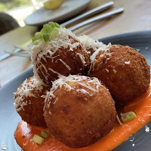 Risotto Arancini crispy outside with a deliciously fresh sauce. Mmmm