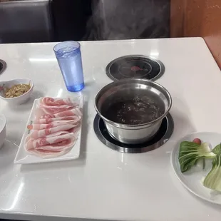 Bulgogi broth and porkbelly. Don&apos;t worry, got a lot more after this ;)