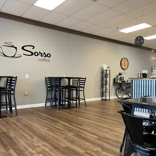 a coffee shop with tables and chairs