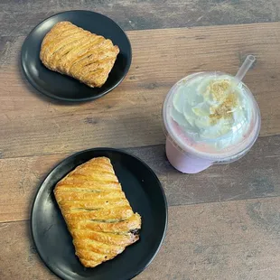 2 of their chocolate croissants and strawberry cheesecake drink