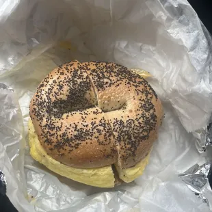 Sausage egg and cheese on a poppy seed bagel