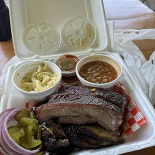 Three meat plate - ribs, sausage, brisket, with jalapeno mac and cheese and brisket baked beans