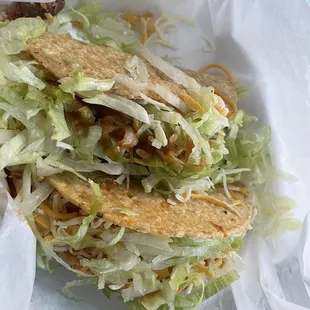 2 crispy shredded chicken tacos