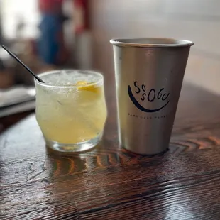 a glass of lemonade and a cup of soda