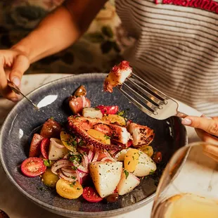 Roasted wild caught Spanish octopus, red potatoes, taggiasca olives, tomatoes, onions.