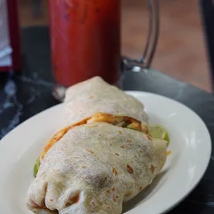 a burrito and a bloody drink