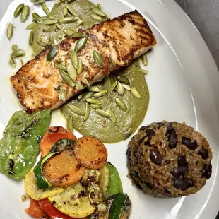 Salmon over Mole verde, with grilled vegetables and casamiento (rice and black beans)