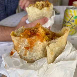 a person eating a burrito