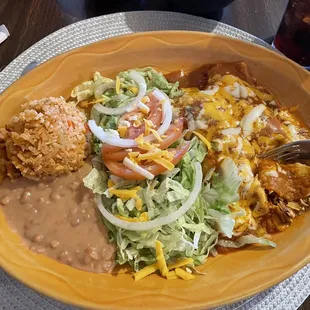 Two chicken enchiladas with beans and rice.
