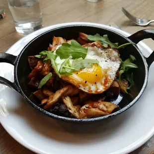 pulled chicken hash with a fried egg on top