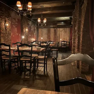 a dining room with wooden tables and chairs