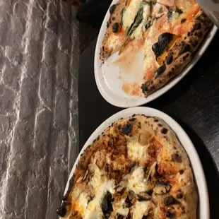 a child cutting a pizza