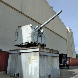 a large gun mounted on top of a box