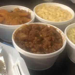 Side of baked beans, sweet yams, Mac &amp; broccoli cheese rice! I also go the smothered pork chops and catfish, both great!!!