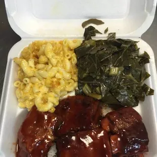 a meal in a styrofoam container