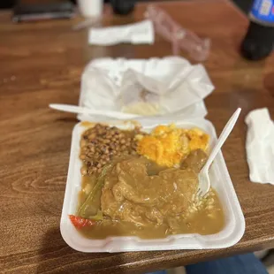 Smothered Chicken and Rice, Black Eyed Peas, Mac and Cheese