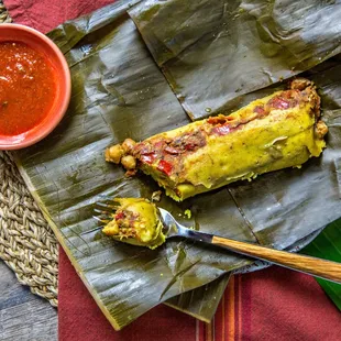 Tamales! Wrapeed in banana leaves, very filling and flavorful. We offer them in 4 different varieties