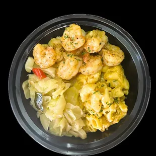 Soul bowl with seasoned shrimp over soul rice or mashed potatoes with Mac &amp; cheese and cabbage.