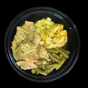 Soul bowl with lemon garlic chicken over soul rice or mashed potatoes, mac &amp; cheese and green beans.