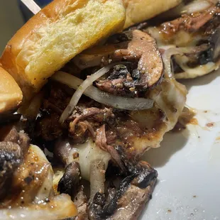 roast beef sliders-- packed with tender roast beef, gravy, provolone cheese, and sautéed onions &amp; mushrooms