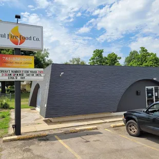 a truck parked in front of a restaurant
