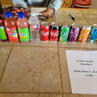 a table full of sodas and sodas