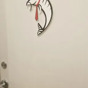 Men's restroom door.