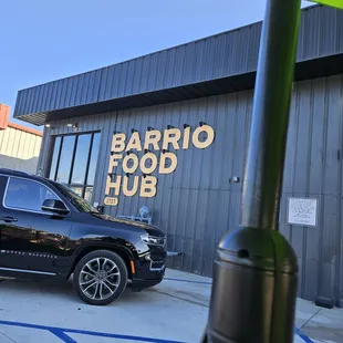 a car parked in front of a restaurant