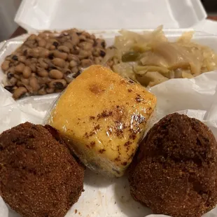 Salmon croquettes, hop n John (black eye peas over rice, cabbage and cornbread.