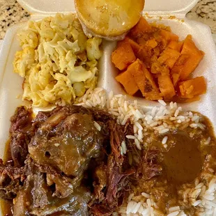 Ox Tails in gravy and rice, Macaroni and Cheese, Yams, and a cornbread muffin yummy