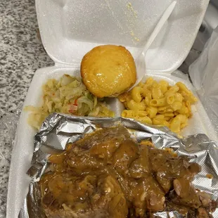 Ox tails. Rice and gravy, Macaroni and Cheese, Cabbage