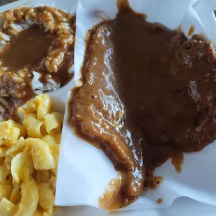 Smothered Pork Chop, Macaroni and Cheese, Rice and Gravy