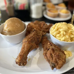 Fried chicken with Mac and cheese and mashed potatoes with gravy