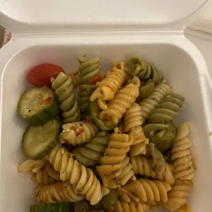 a pasta dish in a styrofoam container