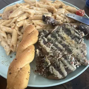 Ribeye Steak Pepper and Alfredo Pasta (half-eaten lol)