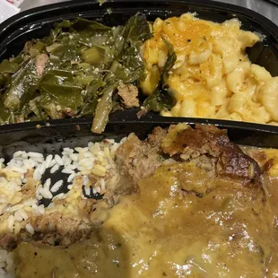 Greens, mac and cheese, smothered meatloaf on Rice