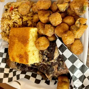 Jerk chicken with dirty rice, okra, and cornbread