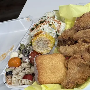 a plate of fried chicken, macaroni and cheese