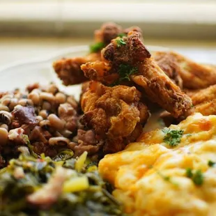 Black eyed peas fried chicken greens and Mac and chesse