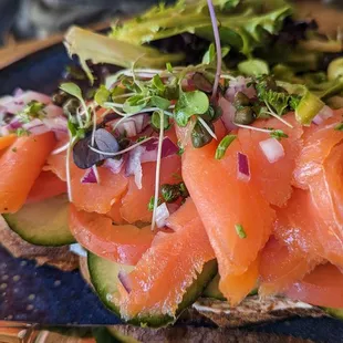 Smoked salmon on a single toast, comes with a side salad