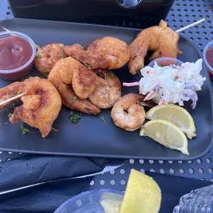 shrimp skewers and coleslaw