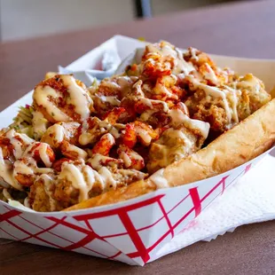 Bayou Classic (grilled shrimp, crawfish, and crispy gator on a french roll with housemade remoulade and pickled slaw) - $20