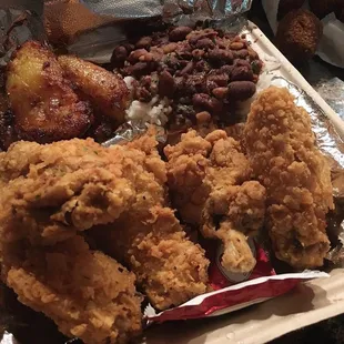 Fried chicken, plantains, and red bean and rice.