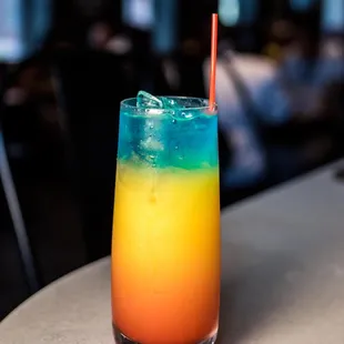 a colorful drink sitting on a table