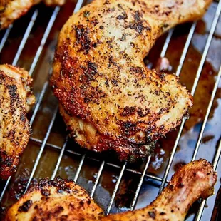 chicken cooking on a grill