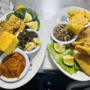 Catfish with mixed greens and yams the other plate has black eye peas and mac and cheese with cornbread