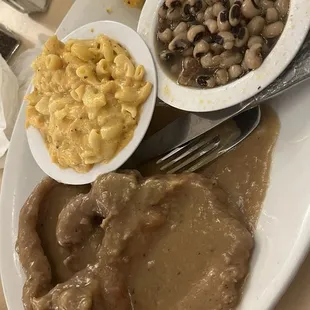 Smothered pork chops, mac &amp; cheese, and Black Eyed Peas